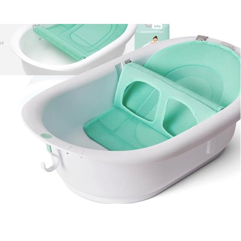 Frida Baby 4-in-1 Grow-with-Me bathtub with green two-sided sling installed