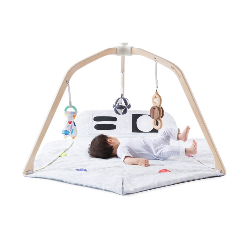 Lovevery Play Gym with wooden frame, hanging toys and black-and-white cards