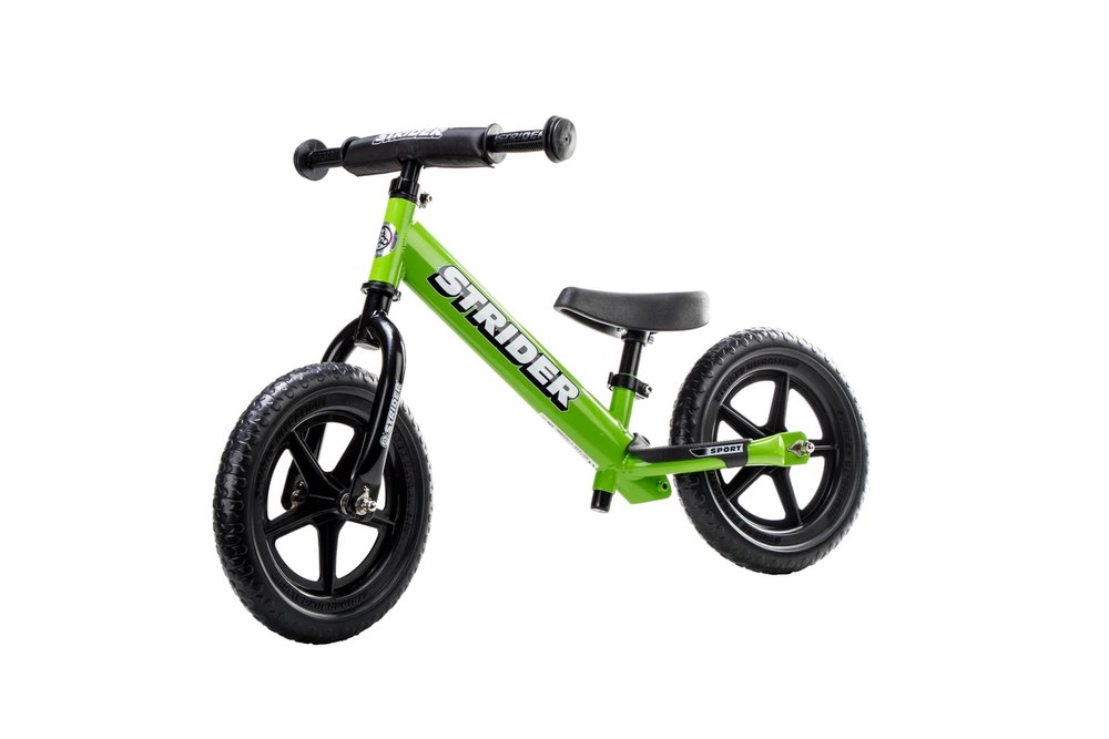 Strider 12 Sport balance bike in green with black wheels and padded seat